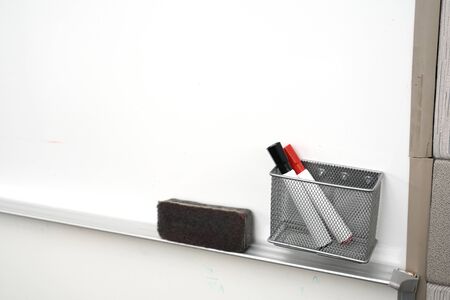 close up on white board with brush and marker in the officeの写真素材