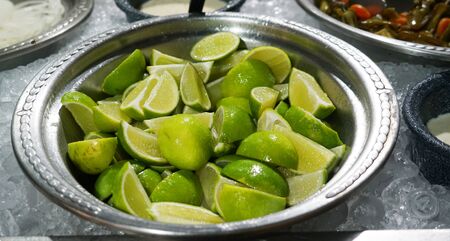 close up on cut lime in the plateの写真素材