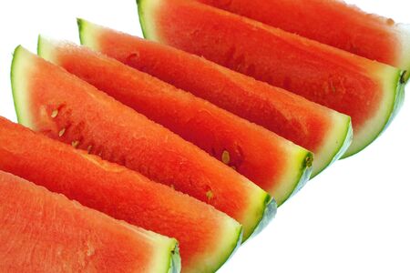 sliced fresh seedless watermelon isolated on white backgroundの写真素材