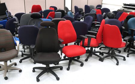 stored chairs in office storage roomの写真素材