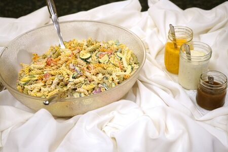 close up on fresh pasta in the bowl on the banquet tableの写真素材
