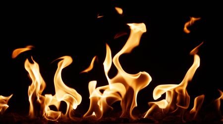burning fire flame on the black backgroundの写真素材