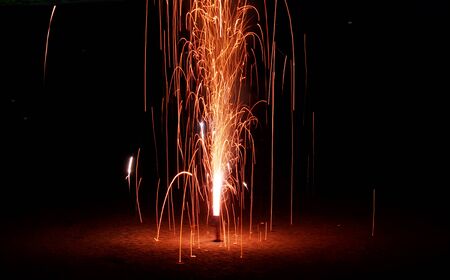 fountain fireworks stream into dark nightの写真素材