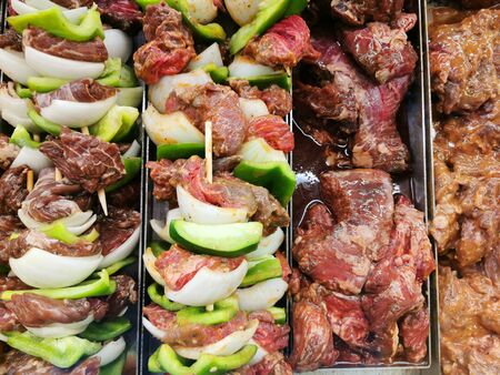 raw meat and vegetable prepared for grillの写真素材
