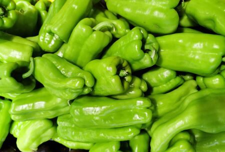 Close up on green bell peppers in harvest season in farm store