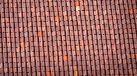 close up on red shingle on the roofの写真素材
