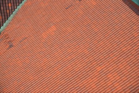 close up on red shingle on the roofの写真素材