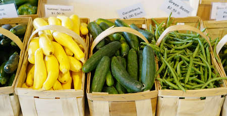 close up on new picked cucumber and green bean in the basketの写真素材