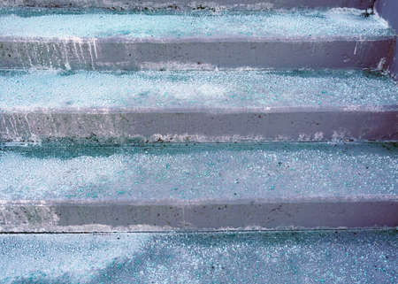 Melting salt on the stair steps in winter seasonの写真素材