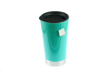 thermal cup with tea bag isolated on white backgroundの写真素材