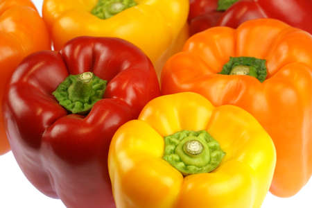 close up on fresh colorful peppers isolated on white backgroundの写真素材