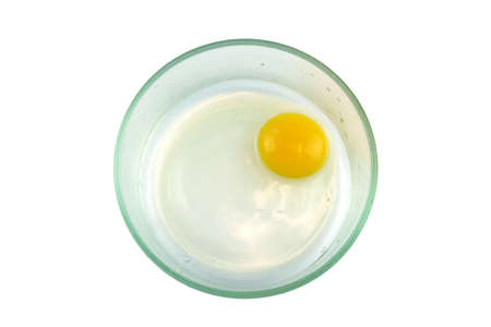 top view of chicken egg yolk in glass bowlの写真素材