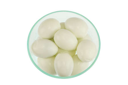 close up on boiled egg in glass bowl isolated on white backgroundの写真素材