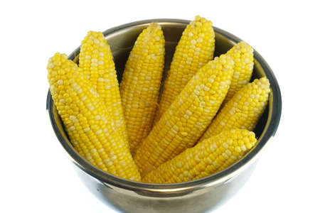 Close up on boiled corn cob inside containerの写真素材
