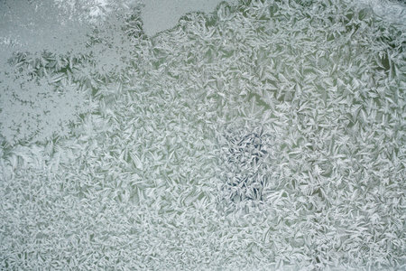 frost crystal on window glass in winter season