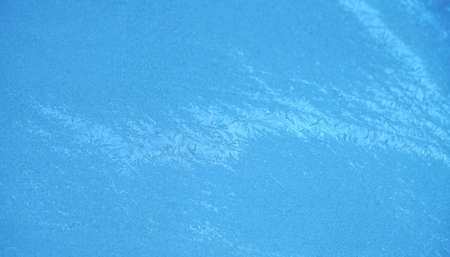 frost crystal on window glass in winter seasonの写真素材