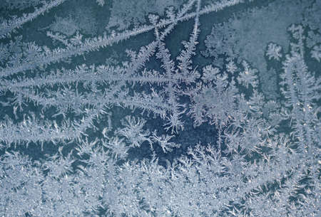 frost crystal on window glass in winter seasonの写真素材