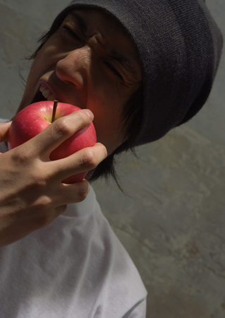 Man holding appleの写真素材