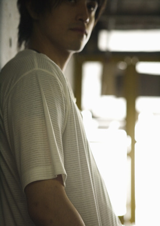Man leaning against wallの写真素材