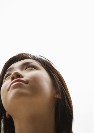 Young woman looking upの写真素材