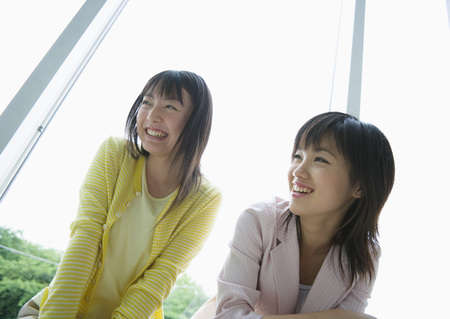 Smiling two young womenの写真素材