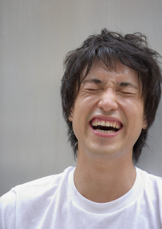 Laughing young manの写真素材