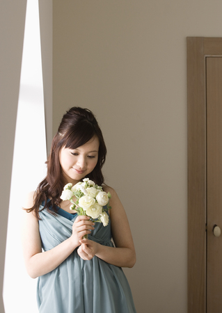 Woman holding bouquetの写真素材