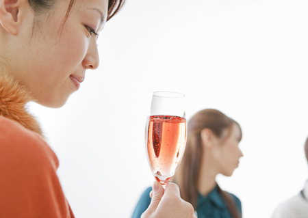 Woman holding a glass of champagneの写真素材