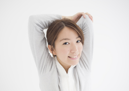 Young woman stretchingの写真素材