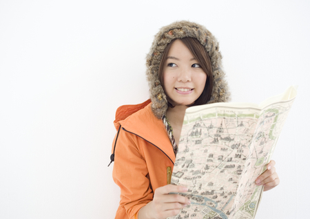Young woman holding mapの写真素材