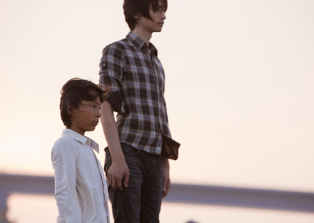 Father and son standingの写真素材