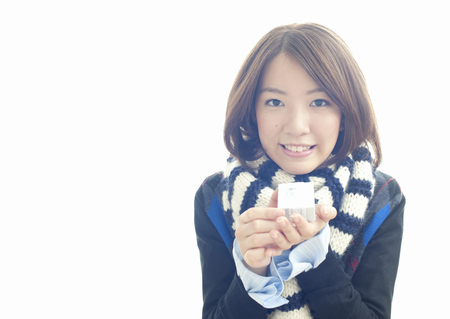 Young woman holding giftの写真素材