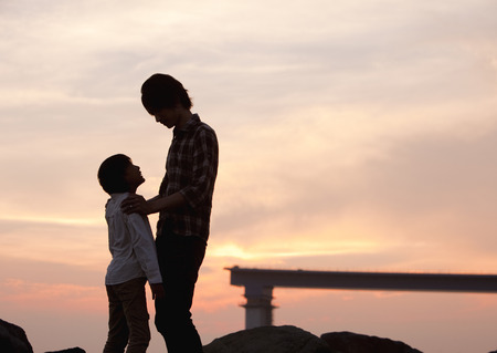 Father and son staring at each otherの写真素材
