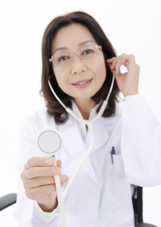 Female doctor holding stethoscopeの写真素材