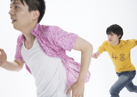 Young men making a dashの写真素材