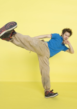 Young man kickingの写真素材