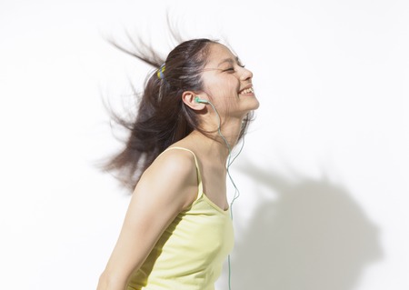Young woman listening to musicの写真素材