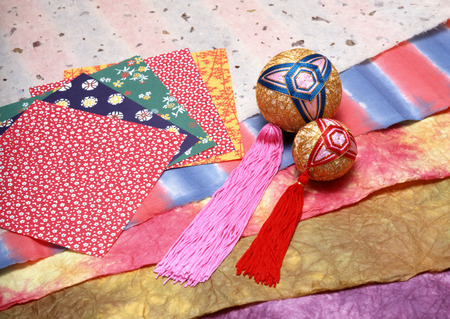 Ball and paper with colored figures