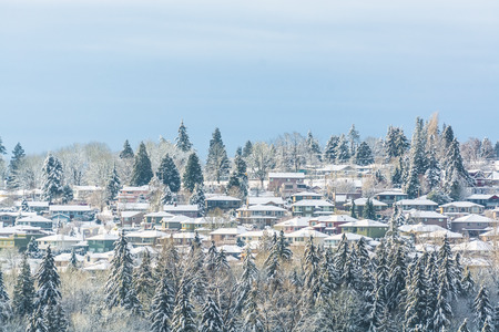 Suburban in the snow. Residential houses in snow on bright winter day in Canadaの写真素材