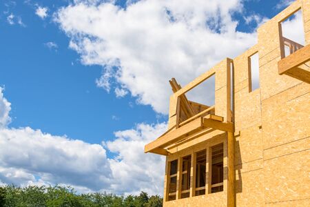 New residential building under construction on blue sky background