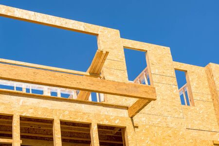 New residential building under construction on blue sky background