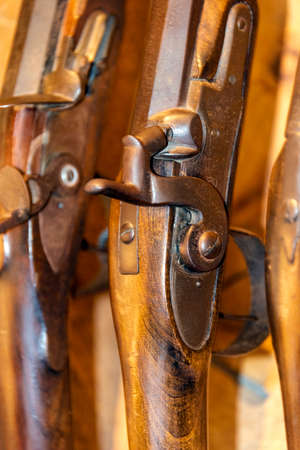 Close up antique rifles staying at a wall.の写真素材