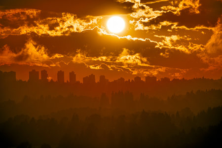 Urban cityscape silhouette on sunset sky backgroundの写真素材