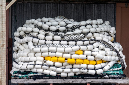 Trawler fishing net and floats stored on wooden pallet