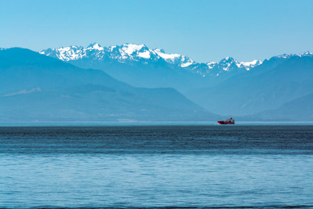 Freight vessel going over the bay on Pacific ocean at Vancouver islandの写真素材