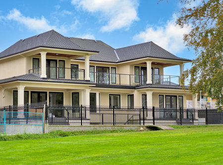 A perfect neighbourhood. New luxury residential house on cloudy sky backgroundの写真素材