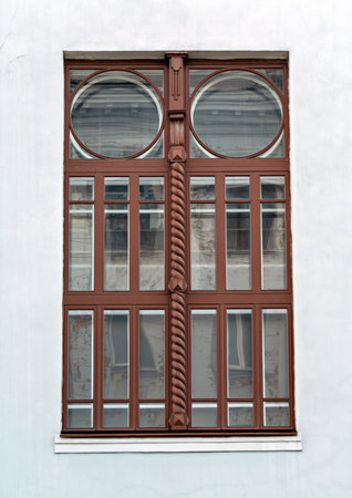 Restored original window of historic building in downtown of Krasnoyarsk city