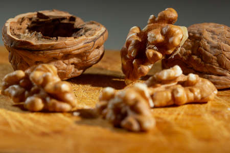 Split nuts on a wooden board in detail