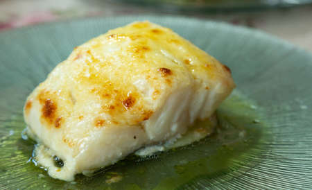 Cod dish with confit potatoes baked in a glass dishの写真素材