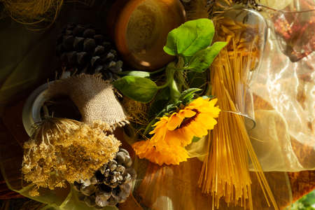 Three beautiful yellow sunflowers in a glass vase are standing on the windowsill of a modern window close-upの写真素材